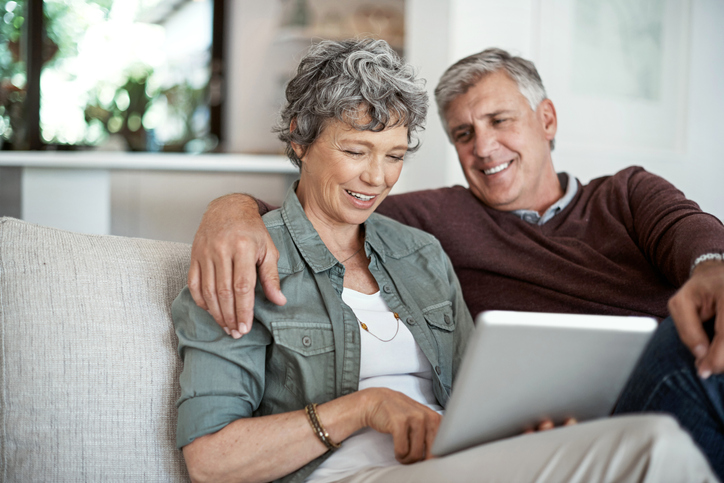 A senior couple researching the differences between a will and a trust in North Carolina.