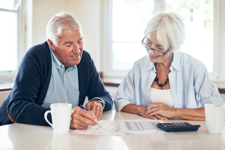 A senior couple reviewing their trust and other estate planning documents that are designed to avoid probate in Missouri. 