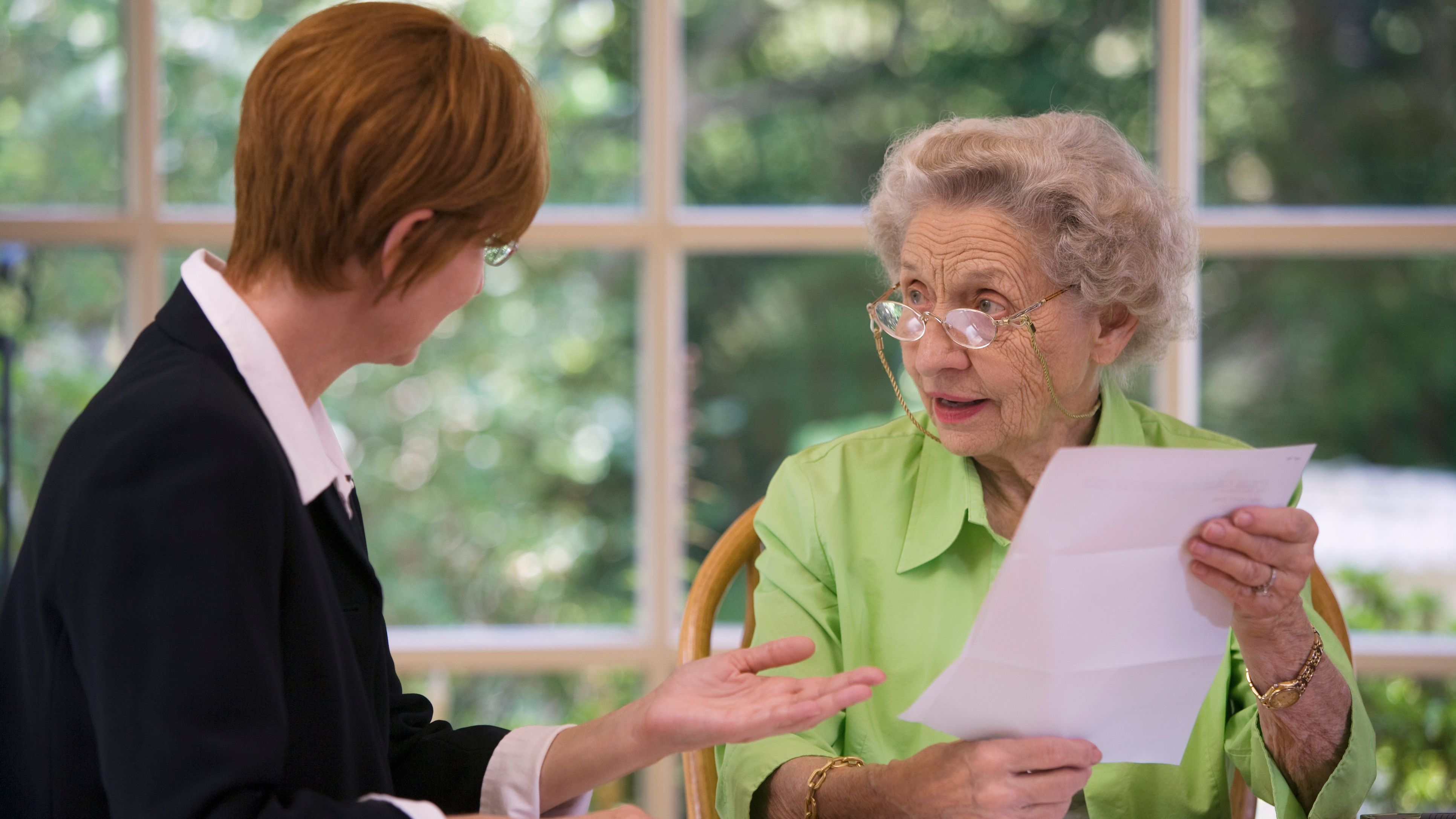 An estate planning attorney meets with a client to discuss her will.