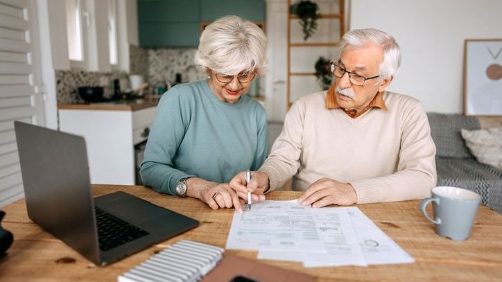 Two 75-year-old retirees go over their finances to ensure their savings can support them for the rest of their lives.