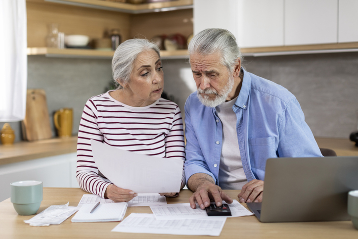 A senior couple comparing the costs of living for a retirement community in every state.