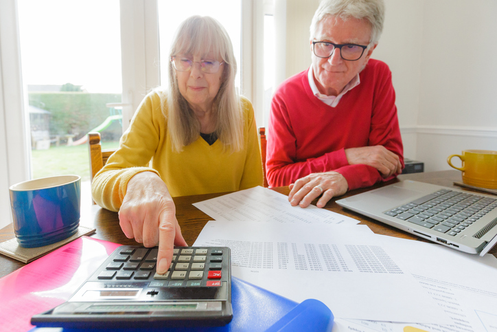 A senior couple estimating their tax liability in retirement.