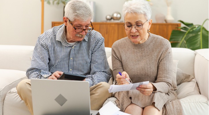 A retired couple looks over how much one of their retiree reimbursement arrangement (RRA) offers in reimbursements. 