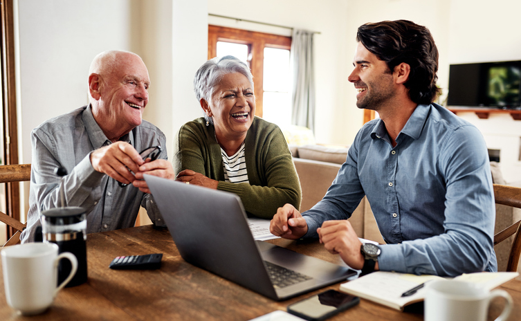 A senior couple meeting with a financial advisor to adjust their retirement savings plan.