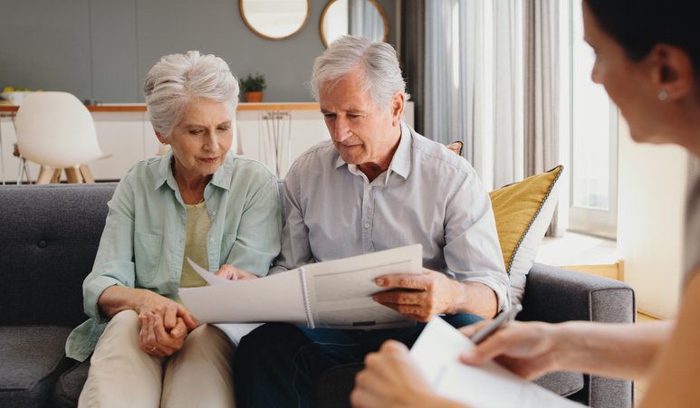 A couple deciding whether a will or living trust is the right choice for them and their beneficiaries.