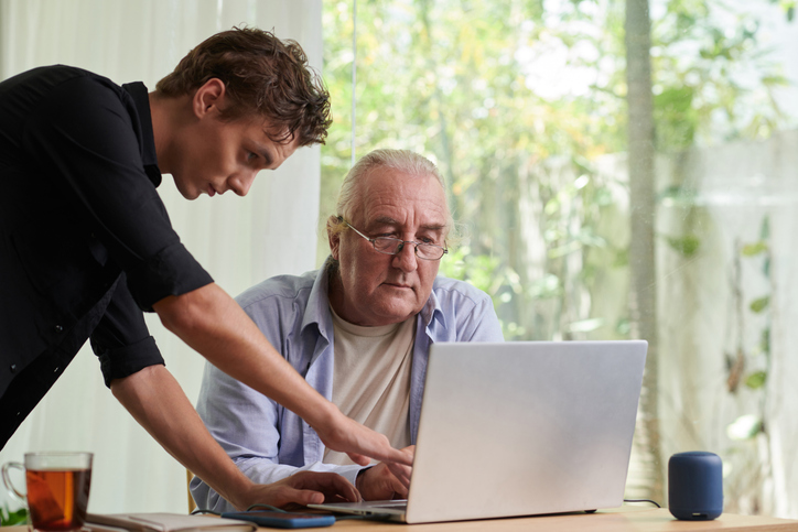 A senior researching with his grandson the requirements for setting up a life estate deed in Florida.