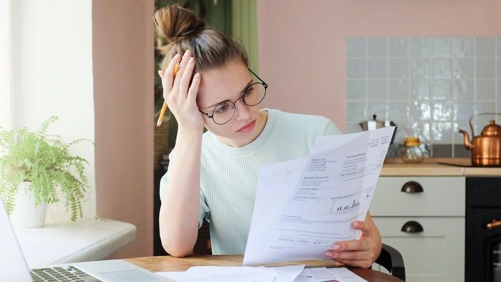 A woman considers taking a 401(k) hardship withdrawal to cover some costs associated with her first home purchase.