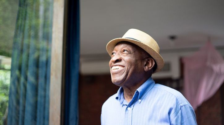 A retiree smiles after finalizing his plan to take a lump sum from his pension plan.
