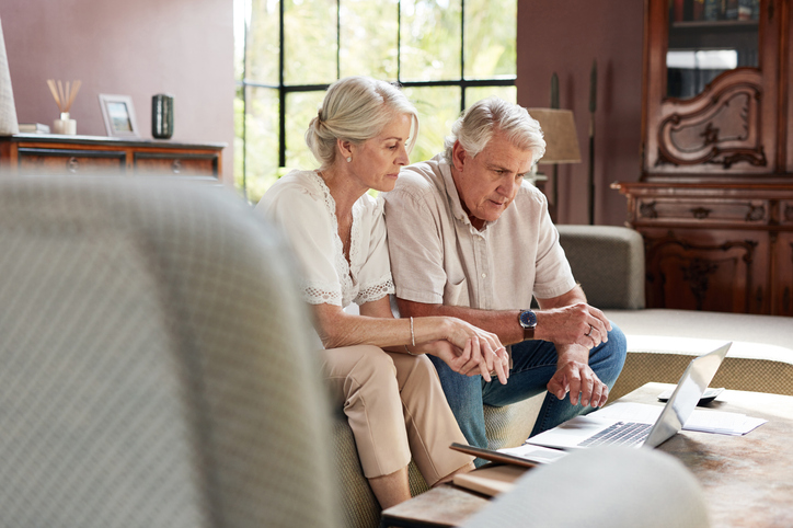 A senior couple researching how a financial power of attorney works in Massachusetts.