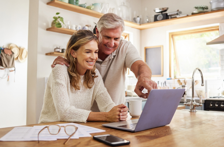 A couple using financial planning tools to set their household budget. 