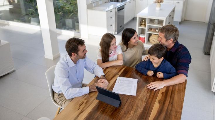 A young family meets with an estate planner.