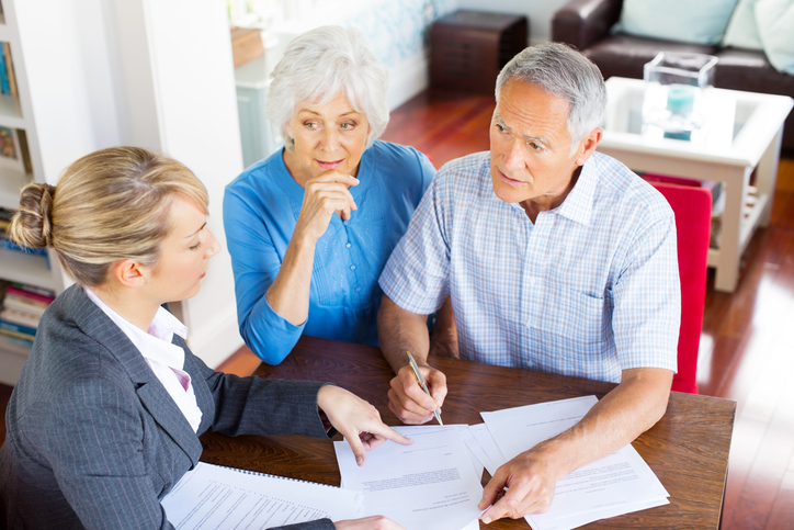 An unmarried couple getting estate planning tips from an advisor.