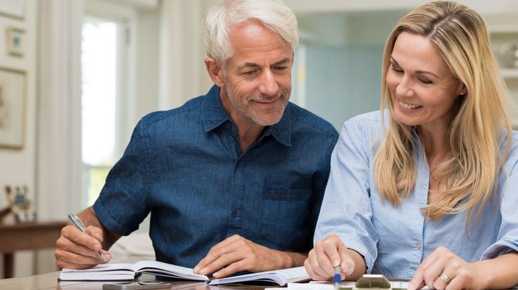 A couple goes over their projected retirement budget together. 