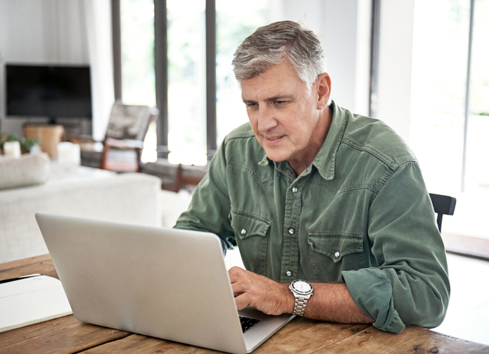 A man approaching retirement, searching for CFP® financial planning services. 