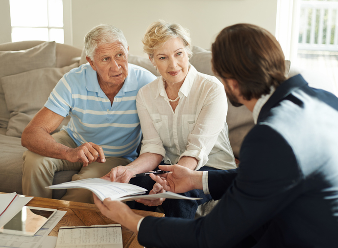 An advisor offering estate planning tips to an unmarried couple.