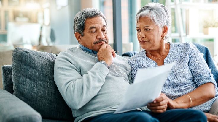 A couple that's on the verge of retiring looks over potential investment options. 