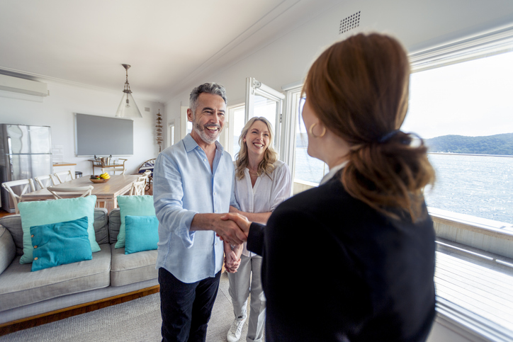 A couple touring a real estate investment.