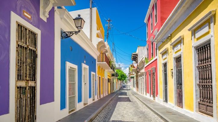 A cobbled alley and colorful houses in Old San Juan, Puerto.