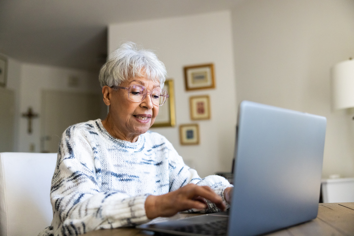 A senior reviewing a retirement plan to align it with her goals. 