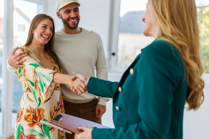 Two real estate investors meeting with an agent.