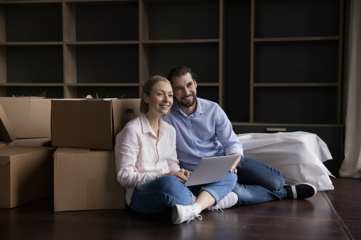 A couple considering investment opportunities after buying a home.