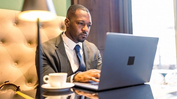 A man who's looking to start a private equity fund works on his laptop.
