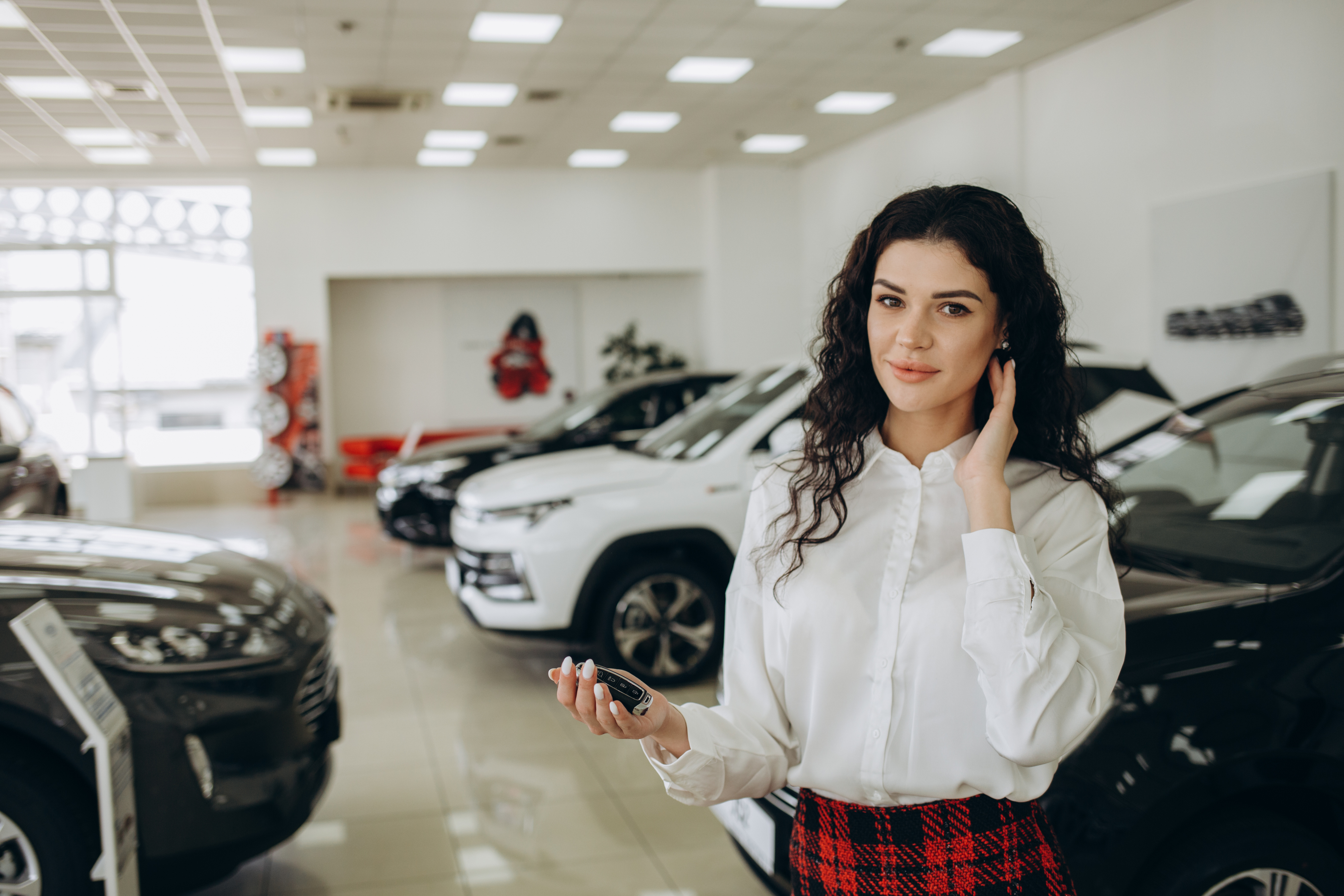 A woman negotiating the sale of a car.