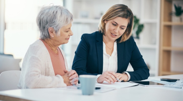 A woman meets with a financial advisor to talk about wealth planning strategies.