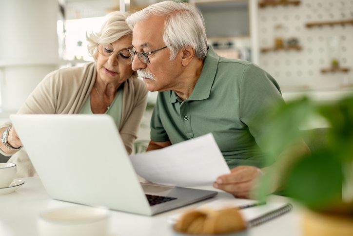 A senior couple reviewing their estate plan.