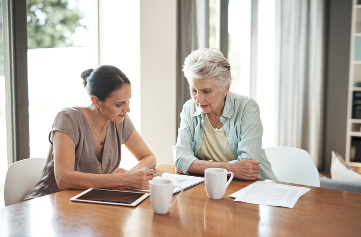 A senior creating an estate plan with her daughter.