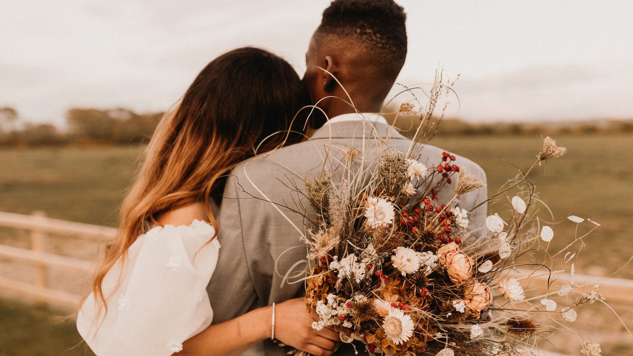 A couple embraces following their wedding ceremony.