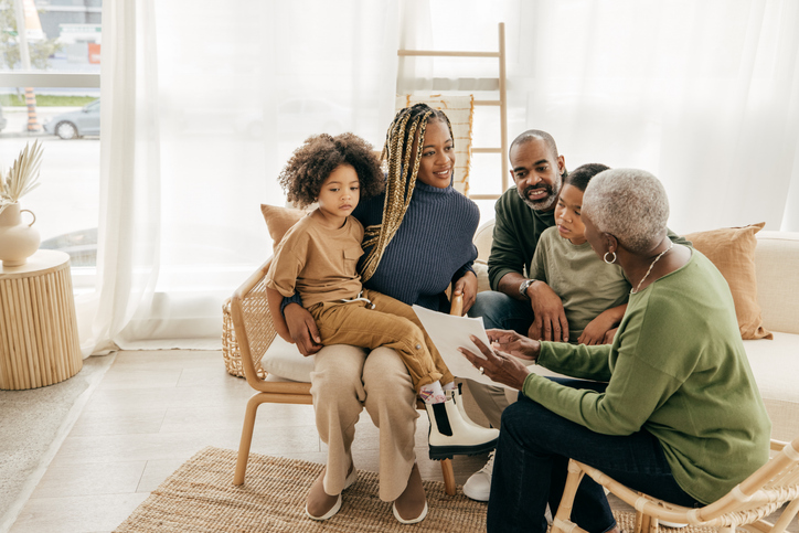 A family sits down to discuss estate planning for elderly parents. 