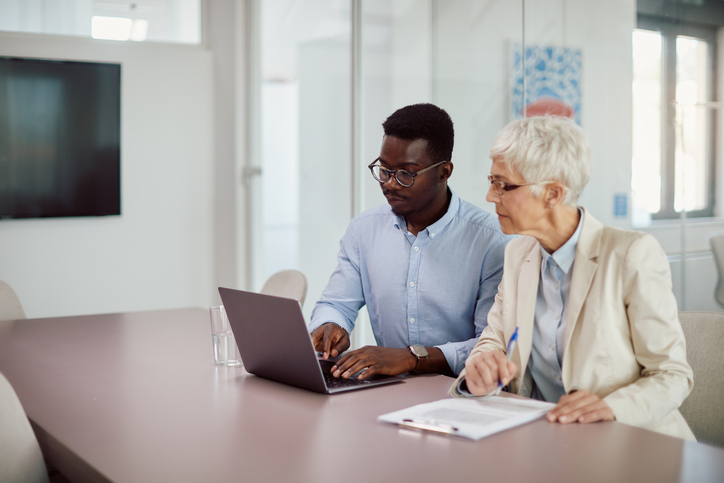 A financial advisor works with a client to diversify their retirement portfolio.