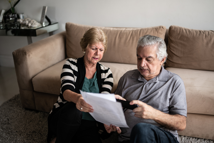 A senior couple naming a charity as a beneficiary.