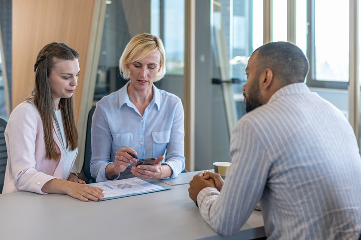 A mother and daughter meeting with an advisor to review their estate plan.