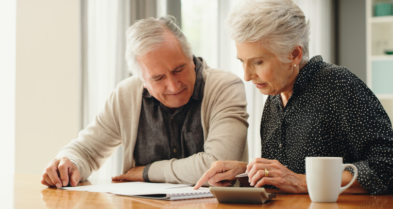 A senior couple reviewing their estate plan.