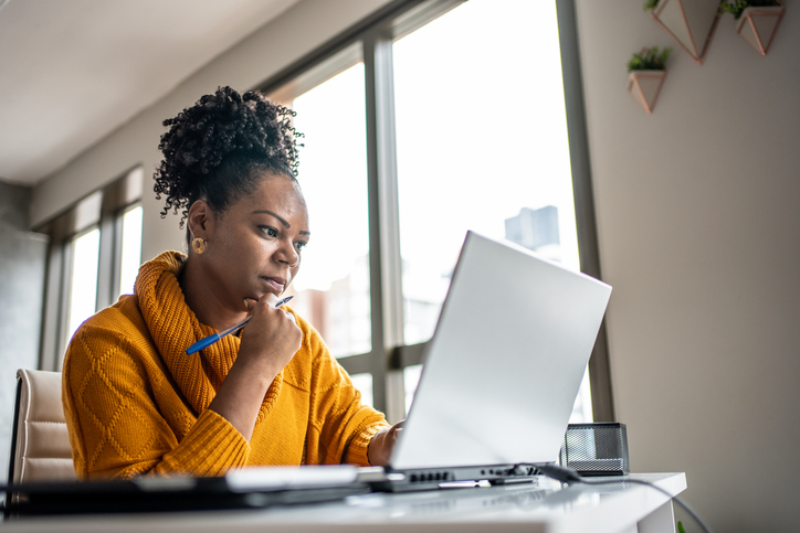 A woman reviews how to run a background check on a tenant.