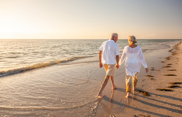 A husband and wife enjoy retirement, the husband having added his wife to his health insurance. 