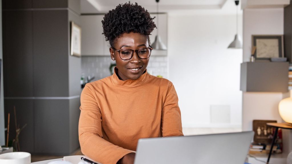 A woman looks up the value of her savings bonds online.