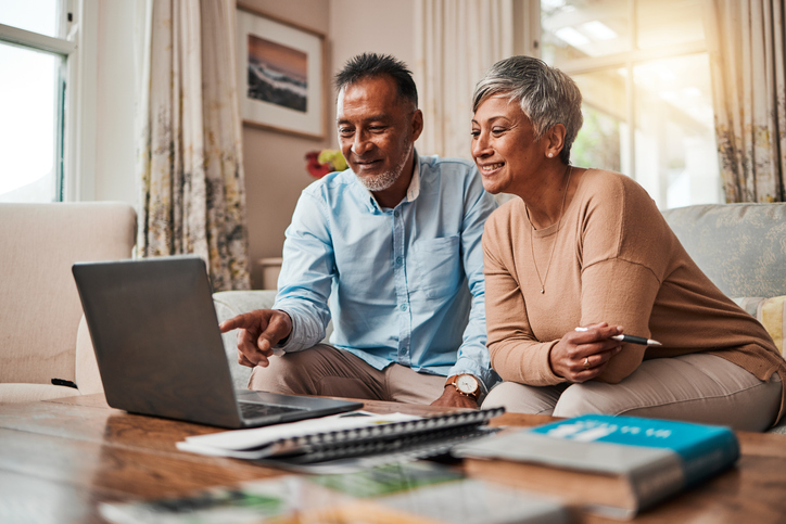 A husband and wife review health insurance for retirees under 65.