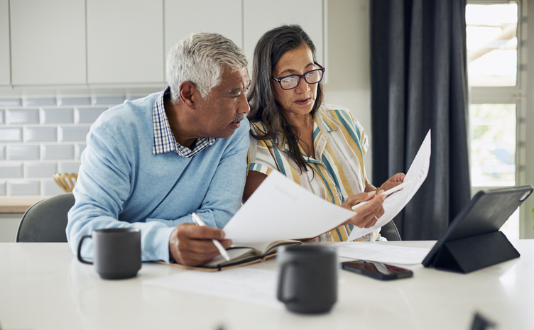 A couple finalizes their estate plan. 