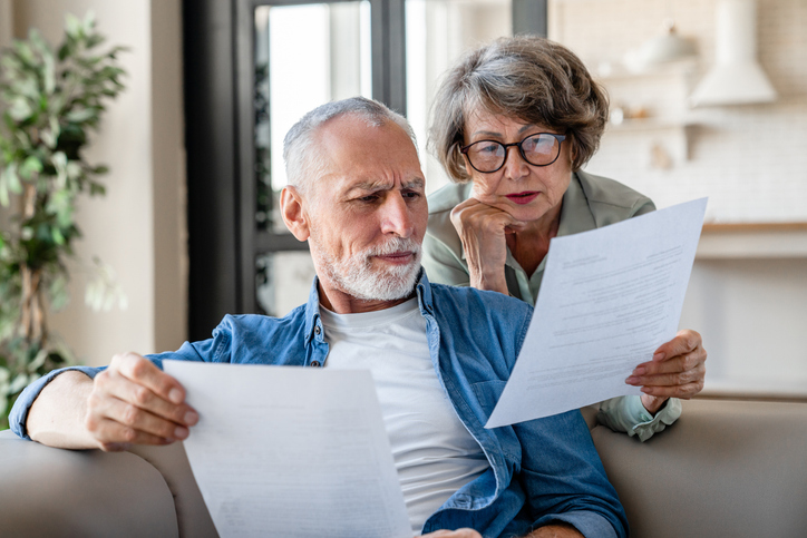 A senior couple reviewing documents for their estate plan.