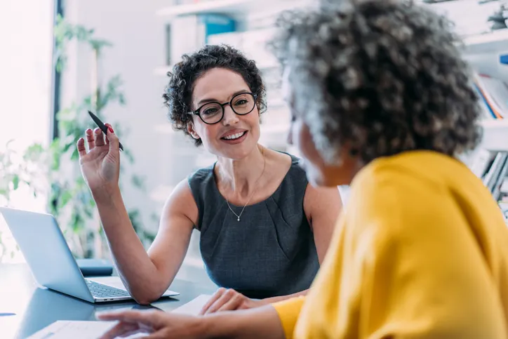 An investor reviewing her portfolio with an advisor.