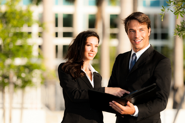 Real estate investors assessing a property. 