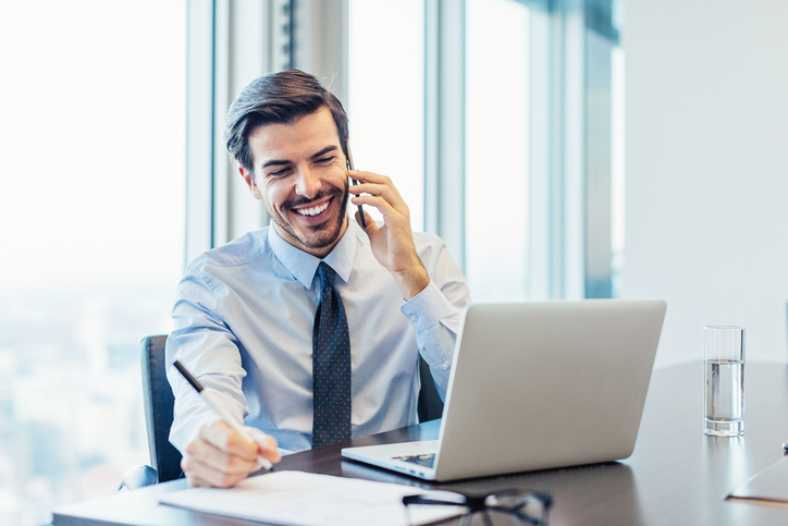 An advisor speaks with a new client, having used a financial advisor lead magnet to meet new prospects. 