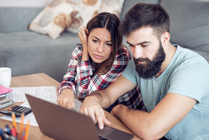 A couple reviewing a debt management plan.