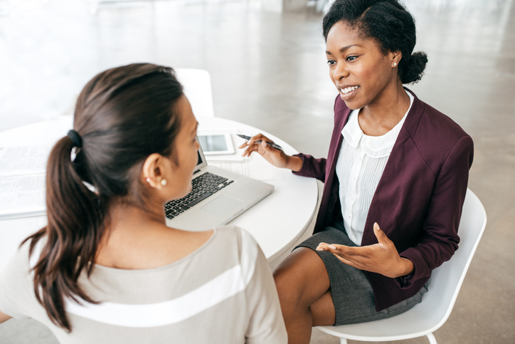 An advisor uses AI notetaking tools during a meeting with a client.