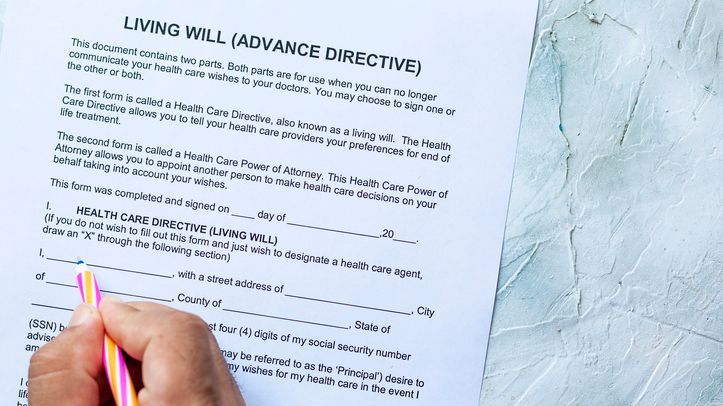 A person fills out an advance directive to establish their wishes for future medical care.