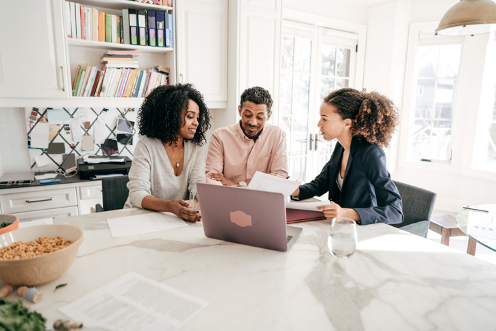 A financial advisor working with a couple to create an estate plan.