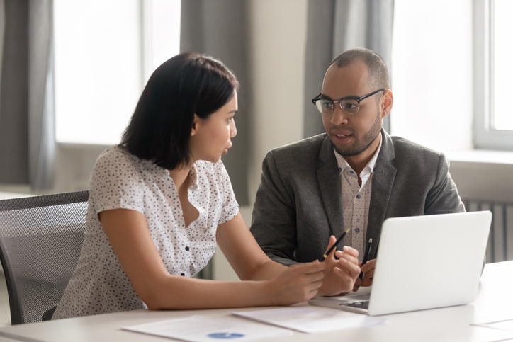 A business owner meeting with a financial advisor to discuss the franchise tax.